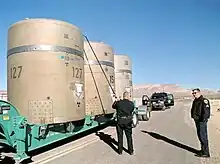 Use of a "hot spot" detector on a long pole to survey waste casks.