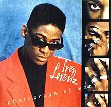 Cover with Trey Lorenz wearing sunglasses and a red suit jacket