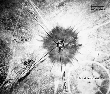 An aerial photograph of the Trinity crater shortly after the test.