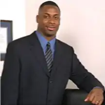 Headshot of Troy Vincent in a suit