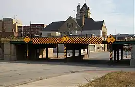 A low bridge hangs over a street