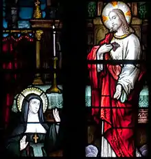 Stained glass at Tuam Cathedral, depicting Marguerite Marie Alacoque when she receives a revelation of the Sacred Heart