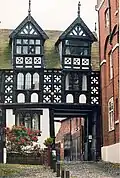 a timber gate house of the tudor period