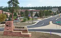 The Tusayan welcome sign with town behind