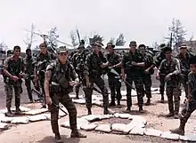 Two 1st Cavalry Division Long Range Reconnaissance Patrol teams, Quang Tri, Vietnam, armed in part with CAR-15s, in July 1968.