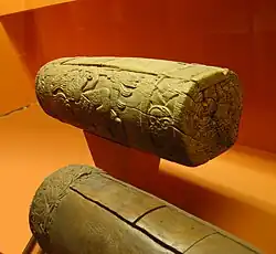 Two Aztec slit drums, called teponaztli.  The characteristic "H" slits can be seen on the top of the drum in the foreground.