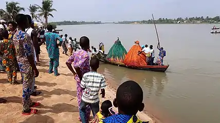 Two Zangbetos landing to the festival area.