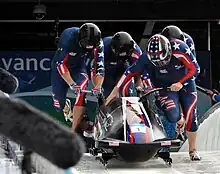 Sled starting run during a sports event.