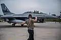 USAF ground crew signals a F-16BM from the No. 9 squadron "Griffins" during Falcon Talon 2022