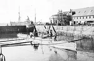 Portsmouth Naval Shipyard with L-8 in 1917, the first submarine built by a US Navy shipyard