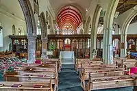 Nave, looking east, showing double aisles to the south (right)