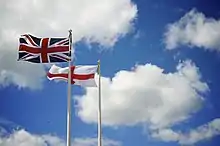 Flag of the United Kingdom, (Union Flag since 1801), flying alongside the Flag of England; the Cross of Saint George.