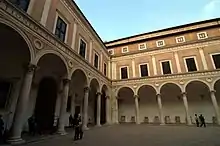 The courtyard of a stone building.