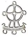 Metal pendant with sun-bird-ship motif, France.