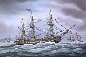 A painting depicting a ship at anchor during rough seas. One side of the ship is prominent in the foreground with the bow and anchor chain to the right of the frame. There are no sails set and only the masts and rigging are shown. Two other ships are shown to the right and left in the far background.