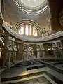 View from inside the crypt with the guarding warriors and death masks visible