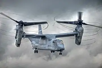 A V-22 Osprey tilt-rotor aircraft at an airshow in 2012