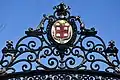 Brown's coat of arms decorates the gate