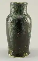 DP vase, c. 1896–1908, gray-white thrown stoneware body, olive green volcanic glaze pitted with yellow-green "craters." A blue-gray and green glaze flowing over the base glaze extending from rim to shoulder, also pitted