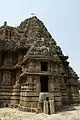 Front view of vesara tower over shrine with minor shrine extension on outer wall in the Someshvara temple at Haranahalli