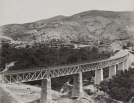 View of a nearby railway bridge showing the village in 1894