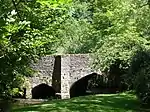 Packhorse bridge 75 m south east of The Old Vicarage