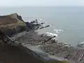 West-south-west view down to a wave-cut platform and a small headland