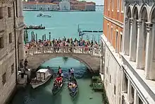 The bridge that stands between the Bridge of Sighs and the Grand Canal, as seen from the Bridge of Sighs itself