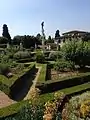 The fountain was originally surrounded by a labyrinth of trees, and also featured a water pipe with hidden nozzles, which could be turned on with a key to drench unsuspecting spectators.