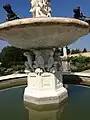 The eight-sided marble base of the fountain was decorated marble statues of life-size children, protected by the basin above as if they were taking shelter from the rain.