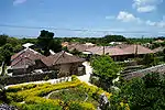 Houses surrounded by low stone walls of unhewn stones.