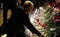 President Vladimir Putin laying flowers at the metro station