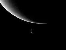 Image 7Neptune and its moon Triton, taken by Voyager 2. Triton's orbit will eventually take it within Neptune's Roche limit, tearing it apart and possibly forming a new ring system. (from Formation and evolution of the Solar System)