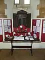 The First World War Roll of Honour inside the porch.