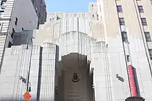 The facade of the Centennial Memorial Temple, which consists of a three-story-high stepped opening surrounded by cast stone