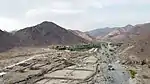 Abandoned tobacco fields sit alongside modern farming areas in the Wadi Helo