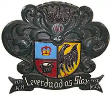 Historical arms of North Frisia with its motto Lever duad as Slav (Better dead than a Slave) where the eagle actually appears in the sinister half. The North Frisian coat of arms is not identical with that of modern Nordfriesland district.