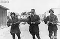 Three Polish resistance fighters pictured after liberating the "Gęsiówka” concentration camp – from left to right: an unknown insurgent, Stanisław Kozicki (code name "Howerla") and Wacław Cyniak (code name "Orlicz")