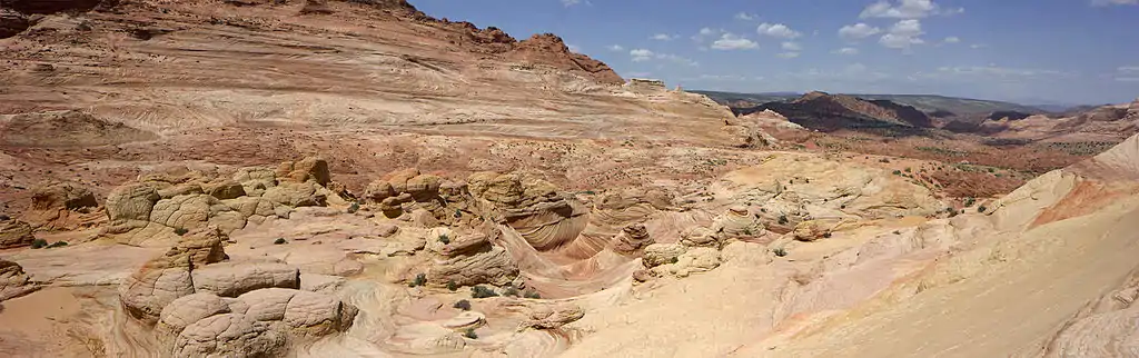 Panoramic photograph of The Wave taken in Arizona looking NNW toward The Wave Trail and the Arizona/Utah border.