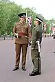 Coldstream Guards officer in No. 2 dress; guardsman wears a form of No. 13 dress