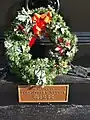 Close up of the burial marker on the base of Werner Cross, Charleston, SC