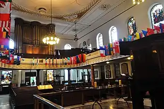 Pews, table and rail, and the organ in the gallery