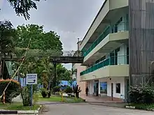 The West Coast Recreation Centre, closed for demolition. Northeast side, where the overhead bridges lead to. The former Jack's Place is seen with the green entrance on the ground floor.