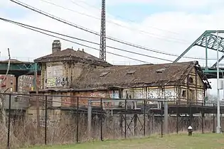 Seen from the southeast showing waiting room section suspended over tracks