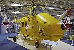 A yellow painted helicopter.