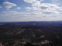 View looking south from the top of West Peak in Meriden, Connecticut. Sleeping Giant State Park can be seen.