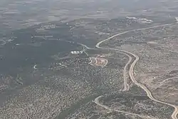 Tura al Gharbiya, in the distance