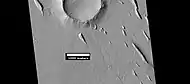 Yardangs near a crater, as seen by HiRISE under HiWish program  Location is in the Amazonis quadrangle.