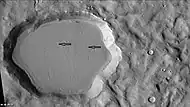 Unnamed crater north of Cerulli, as seen by CTX camera. Floor is covered in "brain terrain."  Arrows point to ring mold craters.  Note: this is an enlargement of previous image.