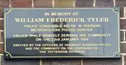 Plaque in memory of PC Tyler on the outside wall of Tottenham Police Station, London.